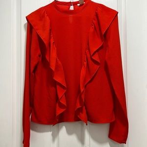 Red- orange ruffled blouse